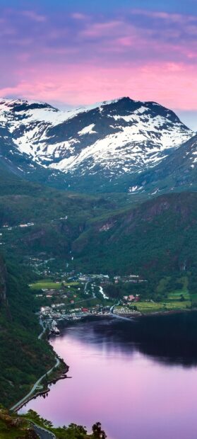 A peaceful view of Norwegian fjords at sunset featuring snowy mountains and calm water, HD Mobile Wallpaper
