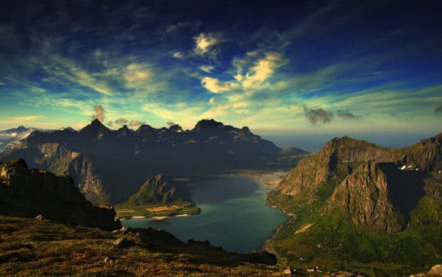 A scenic view of Norwegian fjords with mountains and clouds under a bright sky, HD Desktop Wallpaper
