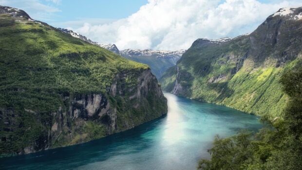 Norwegian fjords with clear blue water flowing between green mountains under a partly cloudy sky, 4K Desktop Wallpaper