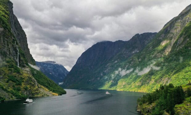 Norwegian fjords with boats sailing through water surrounded by steep cliffs and greenery, HD Desktop Wallpaper