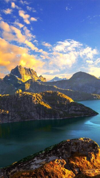 Norwegian fjords wallpapers HD show rocky mountains and calm water under a colorful sky, HD Mobile Wallpaper