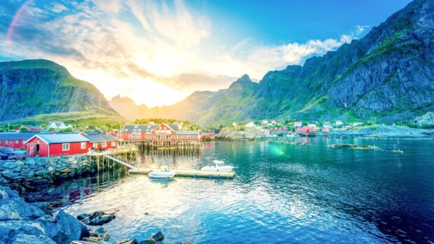A peaceful Norwegian fjord with vibrant houses and boats by the water, HD Desktop Wallpaper