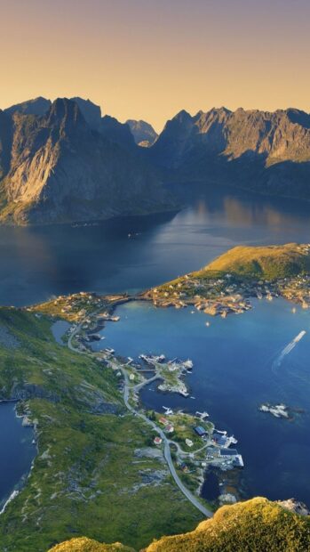 The Norwegian fjords display a coastal village surrounded by mountainous landscape and calm waters, HD Phone Wallpaper