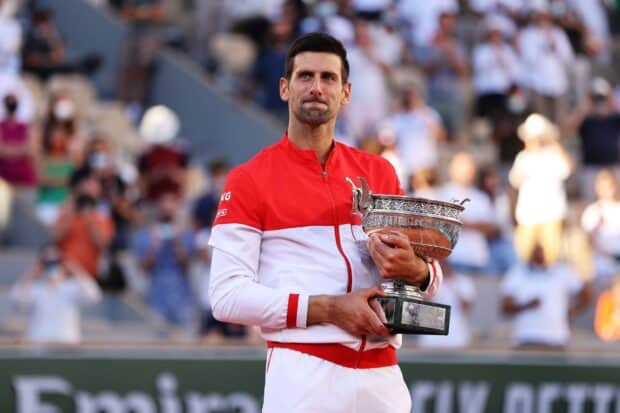 Novak Djokovic celebrates his victory at French Open Roland Garros with the trophy in hand, HD Desktop Wallpaper