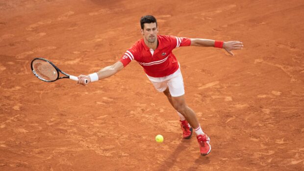 Novak Djokovic is stretching to hit the ball during French Open Roland Garros wallpapers match, 4K Desktop Wallpaper