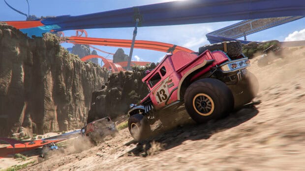 A Hot Wheels car speeds through a rugged desert track with other vehicles and orange race tracks, 4K Desktop Wallpaper