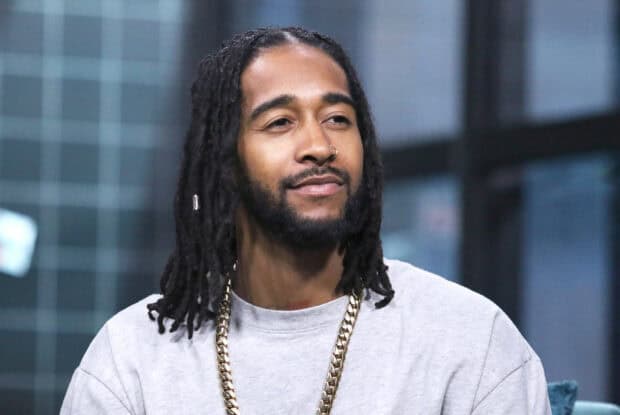 Omarion wallpapers showing a man with dreadlocks and a gold chain dressed in a gray shirt, HD Desktop Wallpaper