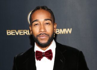 Omarion displays a confident expression wearing a velvet bow tie at a special event, 2K Desktop Wallpaper