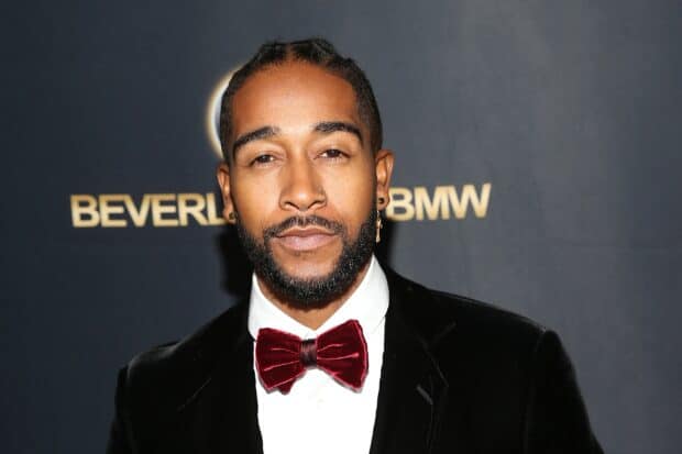 Omarion displays a confident expression wearing a velvet bow tie at a special event, 2K Desktop Wallpaper