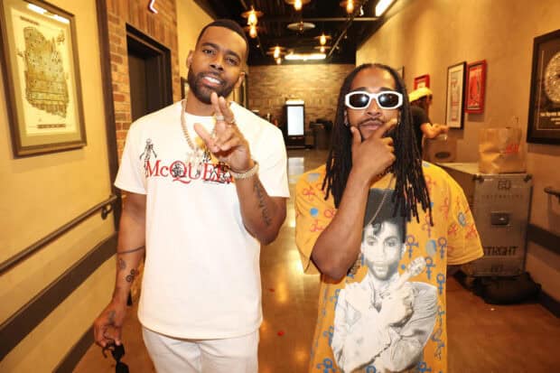 Omarion Wallpapers featuring two men in a hallway with casual streetwear, HD Desktop Wallpaper