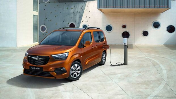 Opel Combo parked and charging at a modern station, HD Desktop Wallpaper