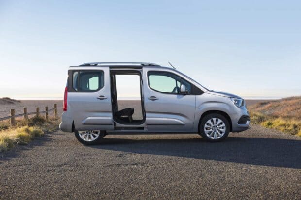 A silver Opel Combo is parked near the coast under clear sky, HD Desktop Wallpaper