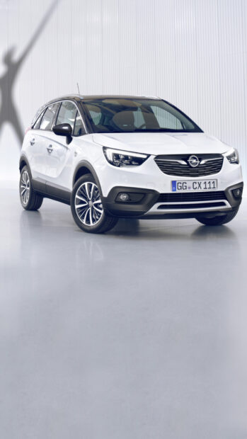 A white Opel Crossland standing in a bright room with shadows on the wall, HD Phone Wallpaper