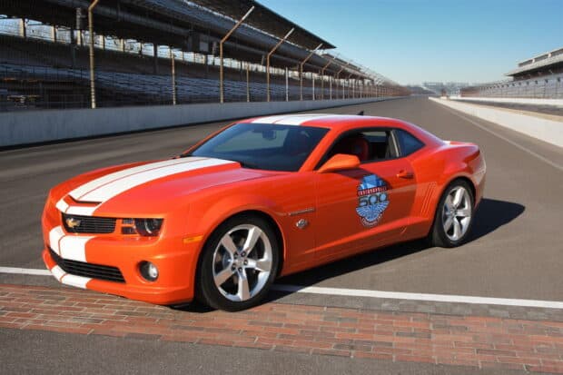 An orange Chevrolet Camaro parked on the track at Indianapolis Motor Speedway, 2K Desktop Wallpaper