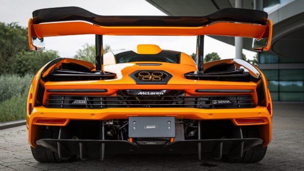 The McLaren Senna showcases its distinct rear design with a prominent spoiler and exhaust, 2K Desktop Wallpaper