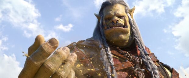 A detailed orc warrior reaches out against a bright sky in a fantasy setting, 4K Desktop Wallpaper