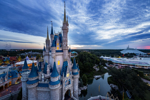 The Orlando castle stands tall with glowing windows under a dramatic sky, 2K Desktop Wallpaper