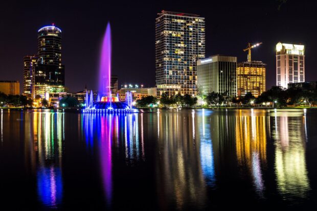 The Orlando city skyline is beautifully illuminated with colorful fountains and building lights, HD Desktop Wallpaper