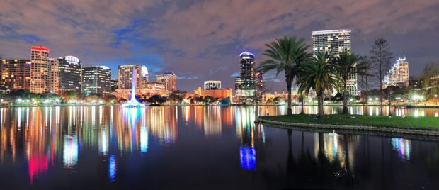 The Orlando cityscape reflects colorful lights on the lake at night, 2K Desktop Wallpaper