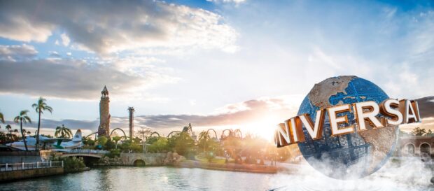 The Orlando park with roller coasters and globe structure at sunset, HD Desktop Wallpaper