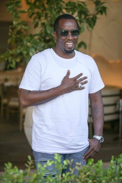 P Diddy Sean Combs wearing sunglasses and a white shirt smiling outdoors, 2K Mobile Wallpaper