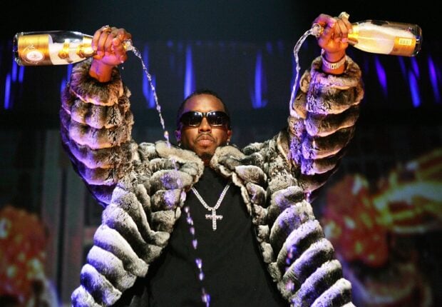 P Diddy Sean Combs wearing sunglasses and a fur coat pouring champagne, 2K Desktop Wallpaper