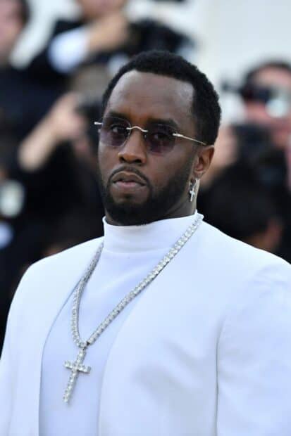 P Diddy Sean Combs wears a white suit with a diamond cross necklace at an event, HD Mobile Wallpaper