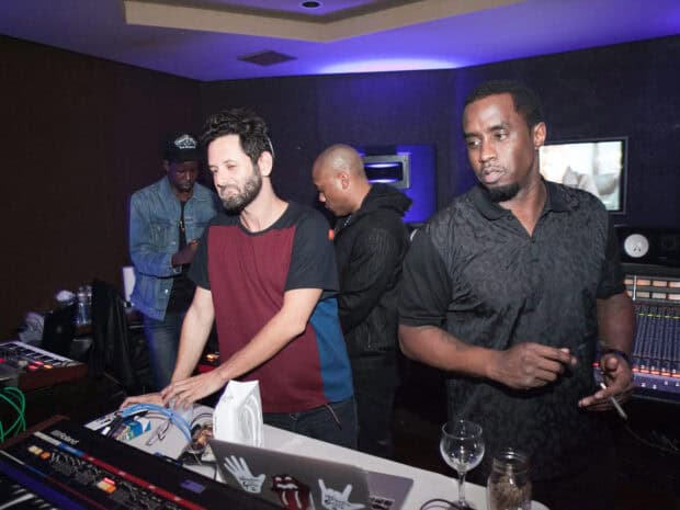 P Diddy Sean Combs is working with a team in a music studio setting, HD Desktop Wallpaper