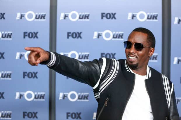 P Diddy Sean Combs is wearing sunglasses and pointing during a FOX event, 2K Desktop Wallpaper