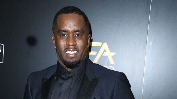 P Diddy Sean Combs smiles at the event wearing a dark suit, HD Desktop Wallpaper
