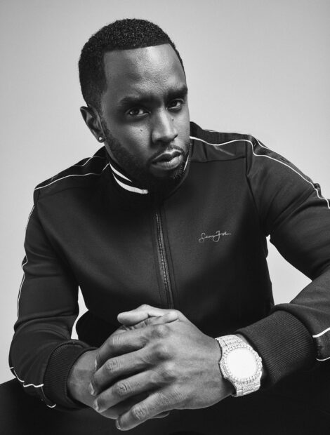 P Diddy Sean Combs sits with hands clasped wearing a dark jacket and a watch, HD Mobile Wallpaper
