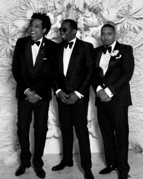 P Diddy Sean Combs stands with two men in tuxedos at an event, HD Mobile Wallpaper
