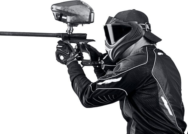 A paintball player wearing protective gear aims with a paintball marker, HD Desktop Wallpaper