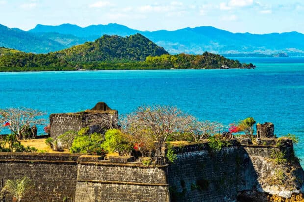 A historic fortress stands against the blue sea and green islands in Palawan, Palawan Wallpapers, HD Desktop Wallpaper