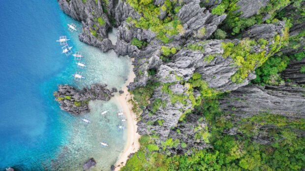 Aerial view of Palawan showing turquoise water and rocky cliffs with boats, HD Desktop Wallpaper