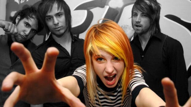 The Paramore band members are posing with intense expressions, HD Desktop Wallpaper