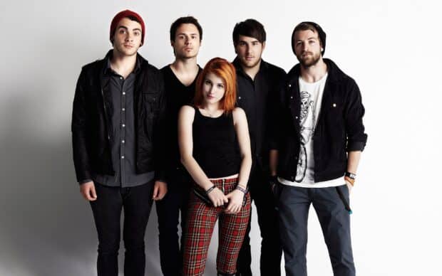 Paramore wallpapers show the band members posing together in casual outfits, 2K Desktop Wallpaper