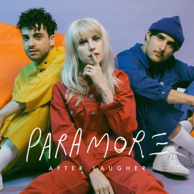 A photo of Paramore band members posing together in colorful clothing, HD Mobile Wallpaper