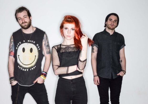 The Paramore band members pose together with confident expressions and unique styles, 2K Desktop Wallpaper