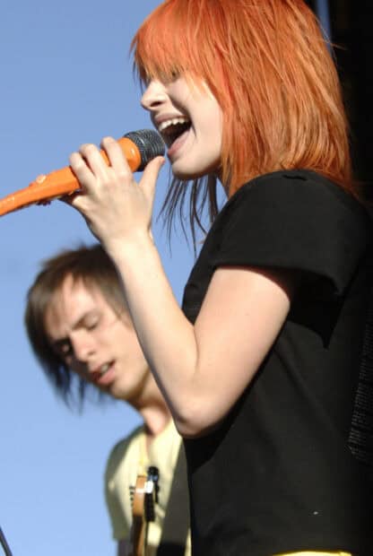 The Paramore lead singer passionately performs on stage during a concert, 2K Mobile Wallpaper