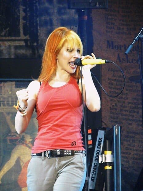The Paramore lead singer passionately singing on stage at a live concert, HD Desktop Wallpaper