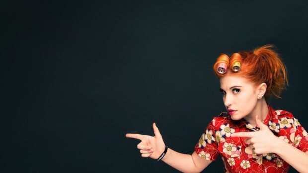 The Paramore singer with vibrant red hair poses with finger guns, HD Desktop Wallpaper