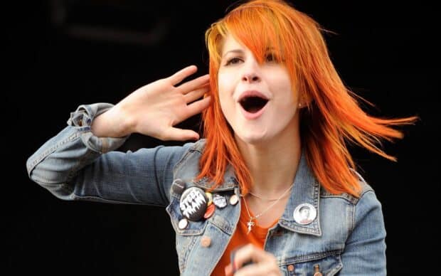 The Paramore lead singer is captured singing with expressive gestures, HD Desktop Wallpaper