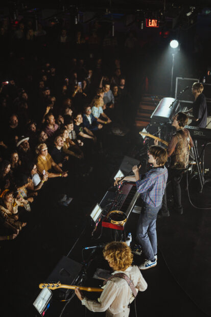 Parcels band performing live on stage in front of an energetic audience, HD PC Wallpaper