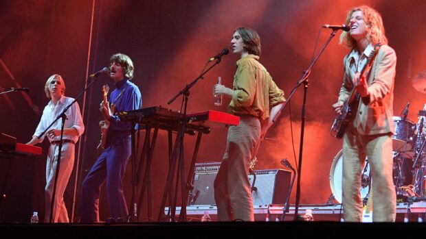 The Parcels Band is playing music together on stage during a concert, HD Desktop Wallpaper