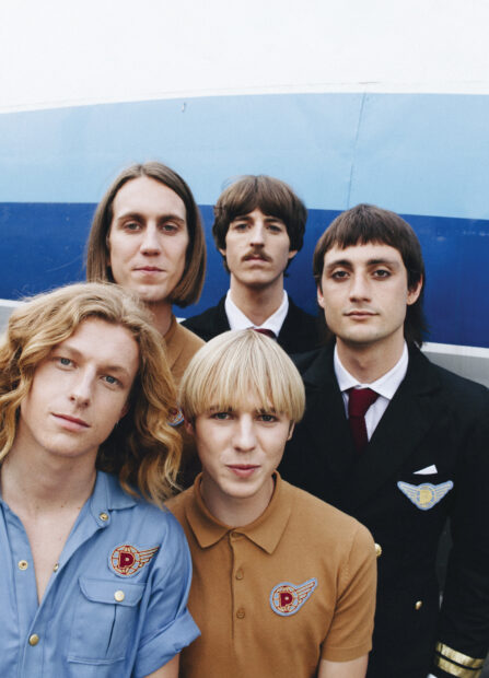 A close up of Parcels band members posing together against a blue wall, HD Mobile Wallpaper