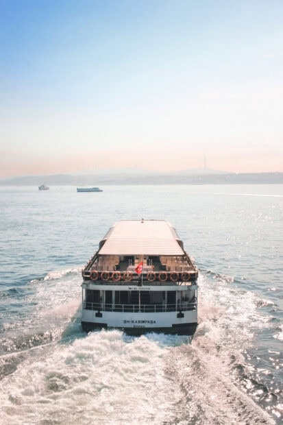 The ferry wallpapers show a boat cruising through sparkling water under a clear sky, 2K Mobile Wallpaper