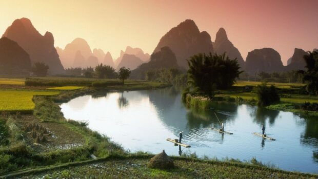 A peaceful river scene features fishermen on rafts in Vietnam Wallpapers surrounded by towering karst mountains, HD Desktop Wallpaper