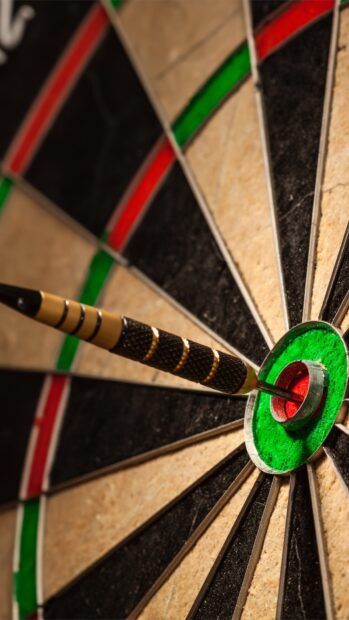 A dart hits the bullseye on a classic dartboard, HD Mobile Wallpaper