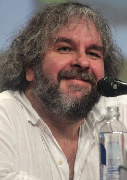 Peter Jackson smiles during an event with a microphone close to him, 2K Mobile Wallpaper